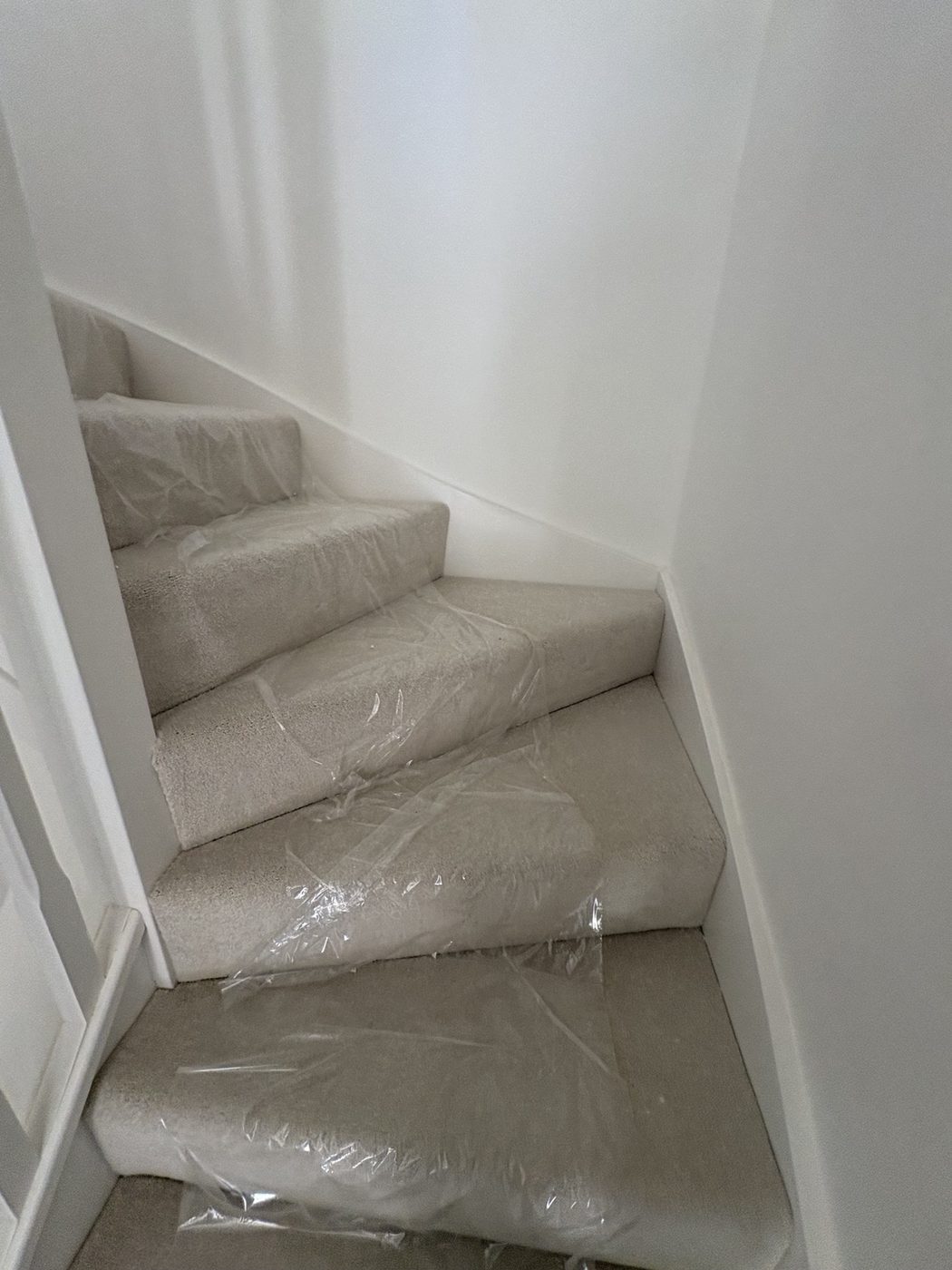 Protective covering on carpeted stairs in a new-build home
